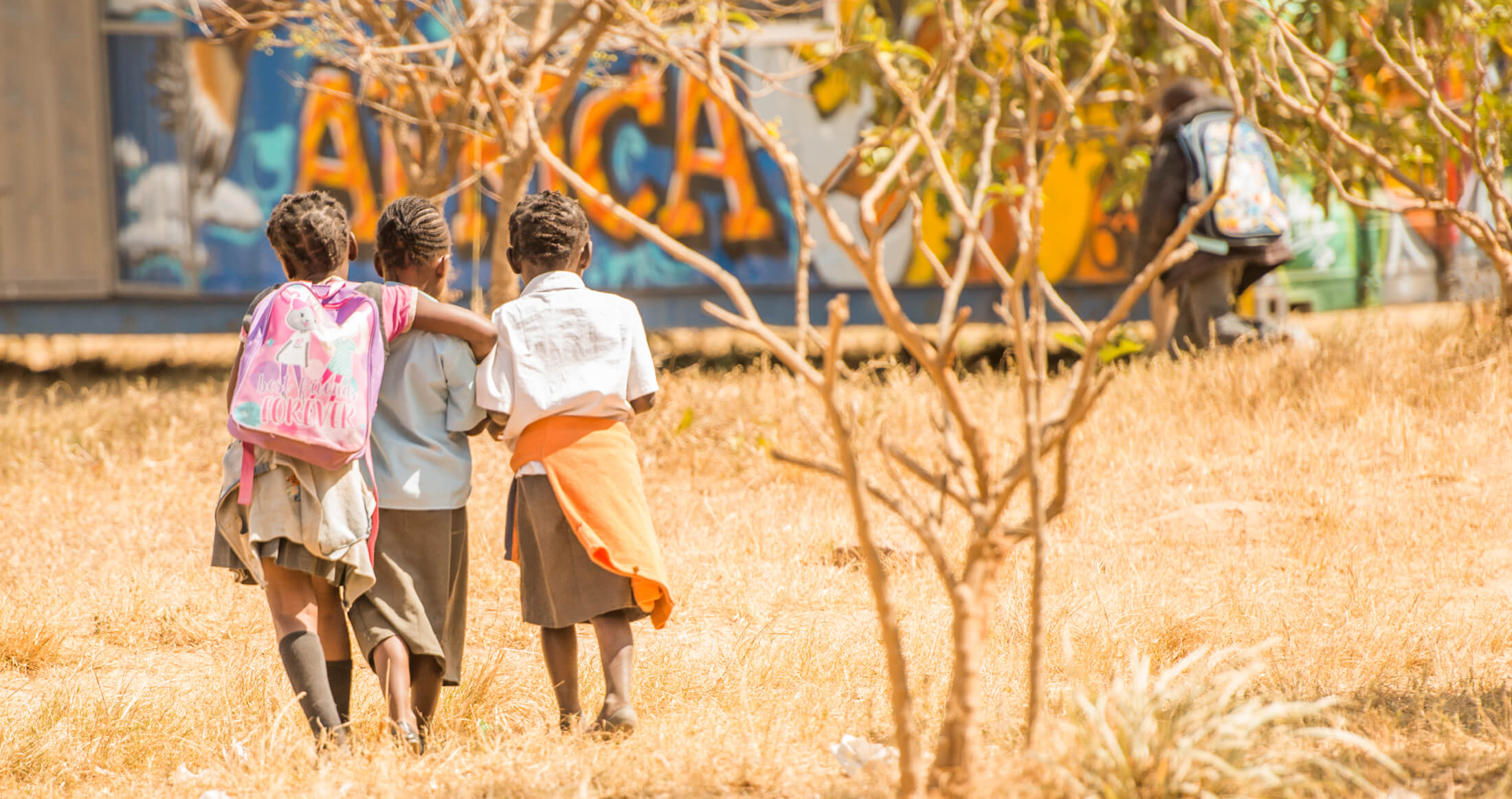 Three Arise Africa students walking together Three Arise Africa students walking together